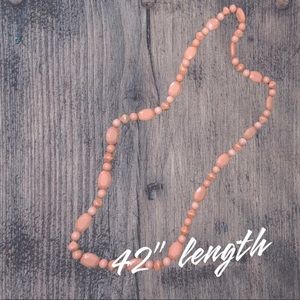 Light coral long beaded statement necklace